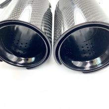 Load image into Gallery viewer, Close-up hight-quality carbon fiber exhaust tips with perforated inner core and sleek black glossy finish, ideal for enhancing performance and aesthetics of sports cars and luxury vehicles
