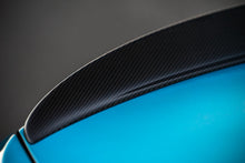 Load image into Gallery viewer, Close-up of an M-Performance style carbon fiber rear trunk spoiler on a blue BMW, M2 and 2 series.
